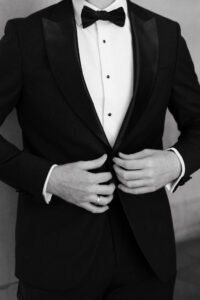 Portrait showcasing the grooms wedding attire