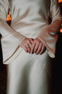 Detail photo of bride's hands, direct flash