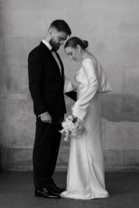 Candid moment between the bride and groom at Cardiff Museum