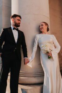 Bride and groom holding hands in Cardiff