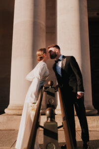 Bride and groom sharing a kiss in golden hour light