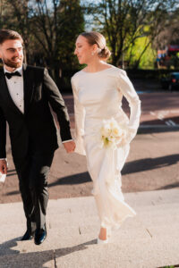 Bride and groom walking together, candid shot