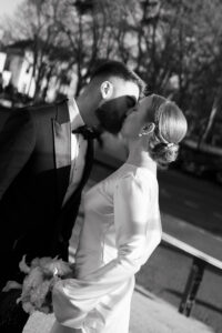 Bride and groom kissing at Cardiff Museum