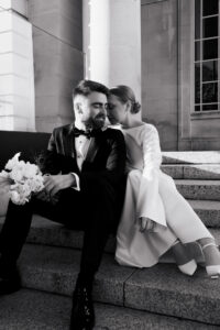 Intimate black-and-white moment between bride and groom