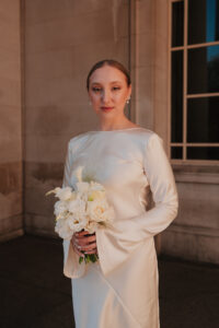 Bride posing alone at Cardiff Museum