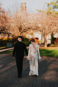 Bride and groom walking together, candid shot