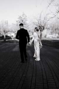 Black-and-white candid of bride and groom in Alexandra Gardens