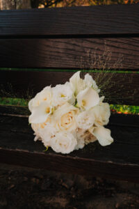 Bride's bouquet resting on a park bench in Cardiff