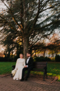 Blurry, autumnal portrait of wedding couple