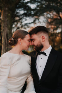 Bride and groom placing foreheads together in Alexandra Gardens