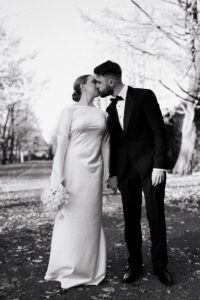 Bride and groom kissing, black-and-white
