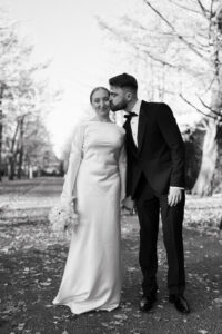 Black-and-white moment of bride and groom in Bute Park