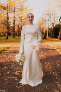 Solo moment of bride posing in her wedding dress