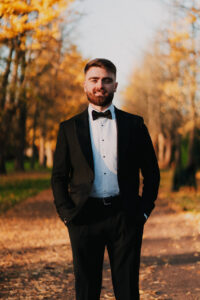 Groom smiling in wedding portrait