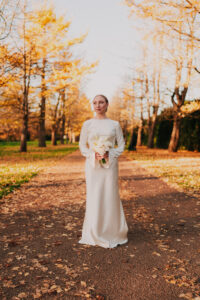 Symmetrical portrait of bride in Bute Park at Golden Hour