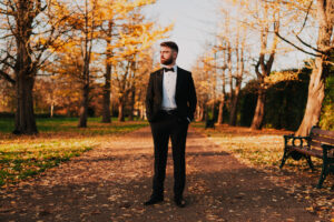 Wide portrait of groom in his wedding suit