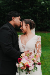 Wedding portrait of groom kissing bride's forehead at Celtic Manor Resort