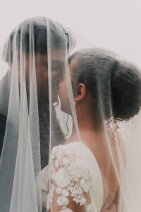 Romantic portrait of bride and groom under the veil at The Celtic Manor Resort