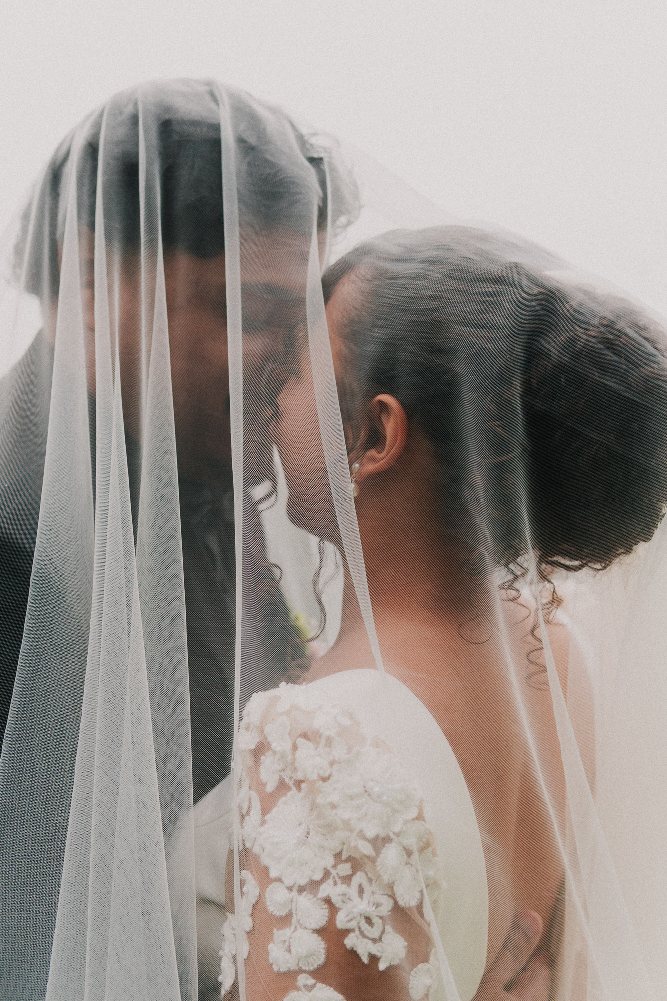 Romantic portrait of bride and groom under the veil at The Celtic Manor Resort