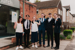 Wedding guests cheering at Waterloo Church in Ruislip
