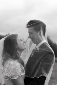 Portrait of the bride and groom under the veil